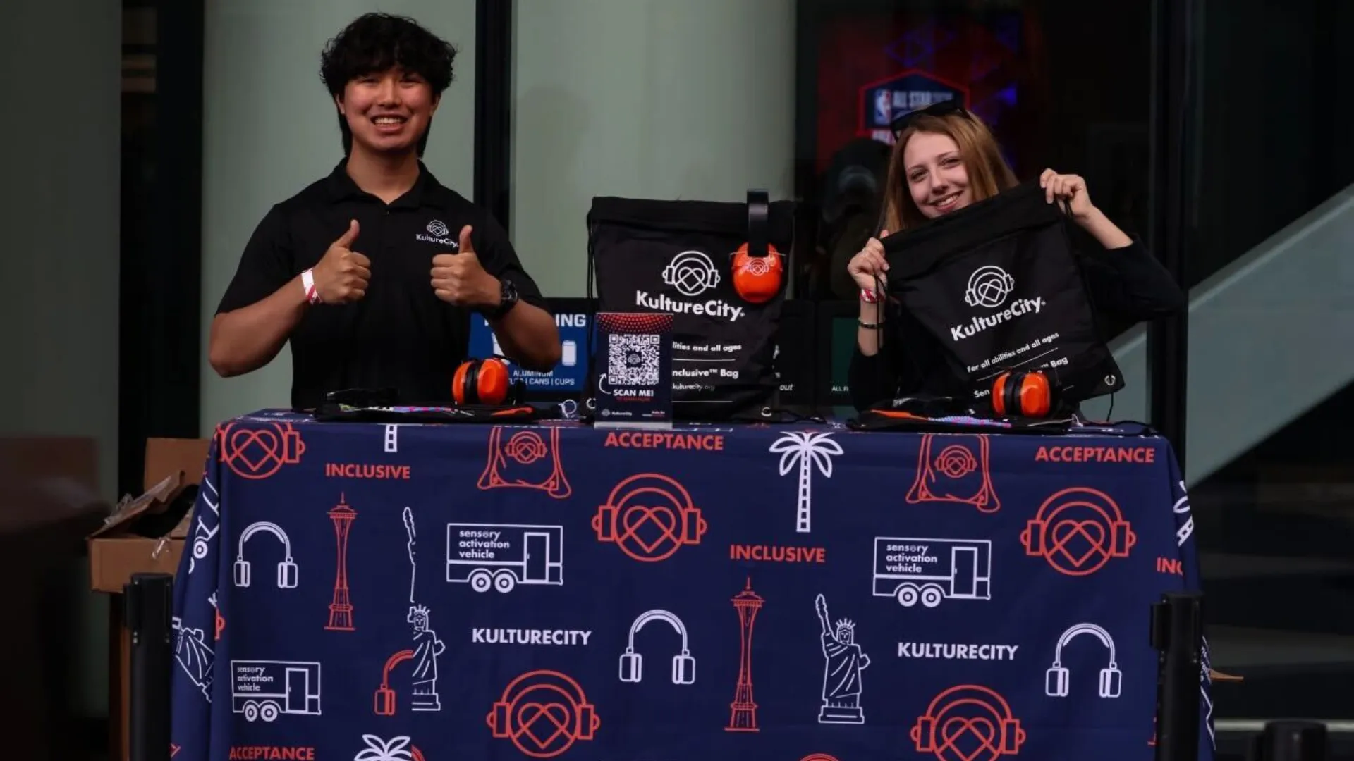 Two volunteers with KultureCity bags